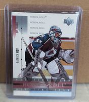 Front view of Upper Deck Honor Roll Patrick Roy card in plastic sleeve