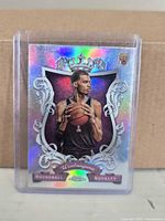 Front view of Victor Wembanyama Roundball Royalty holographic rookie card in protective holder