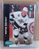 Front of Parkhurst Wayne Gretzky 1,000-Point Club card in plastic sleeve