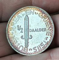 obverse showing sword and denomination