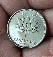 Reverse with stylized maple leaf and dates 1867-2017