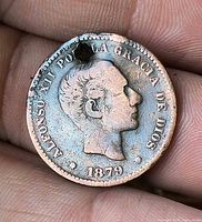 Obverse showing Alfonso XII portrait, year 1879 and hole near rim