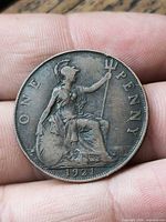 Reverse showing Britannia, denomination ONE PENNY and date 1921