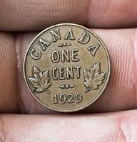 Reverse side showing maple leaves, denomination and date 1929