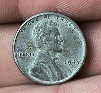 Obverse view showing Lincoln bust, date 1943, motto and wear