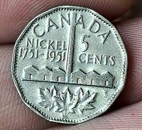 Reverse displaying CANADA, NICKEL 1751-1951, 5 CENTS, mine design and maple leaves