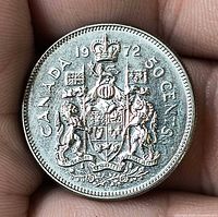 Reverse of 1972 Canadian 50-cent coin showing Coat of Arms and date