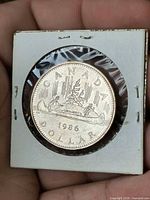 Obverse showing canoe design, year, denomination