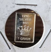 Obverse of silver bar showing crown design and inscriptions