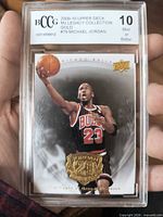 Front view of graded Michael Jordan Upper Deck Gold card showing grade label and card design