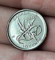 Reverse of Canada 150 10-cent coin showing Wings of Peace design