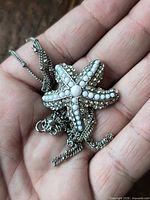 Front view of starfish pendant with beads and rhinestones on chain