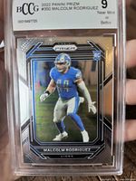 Front of slabbed Malcolm Rodriguez Prizm rookie card showing BCCG 9 label