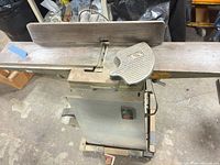 Full view of jointer-planer with fence and push-block on bed