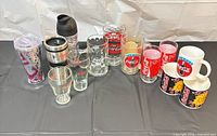 All 13 Coca-Cola drinkware pieces displayed together