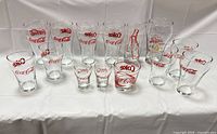All 16 glasses arranged to show variety and logos