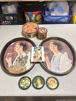 overview of both trays, tins, coasters and card