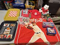 Overall view of lot on table showing trays, tins, towel, hat, bear, pins