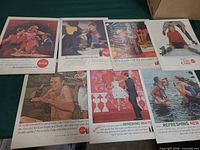 Group shot of all six Coca-Cola ad pages laid out