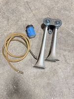 Full view of horn assembly, compressor, hose and hardware