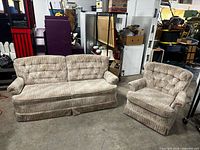 Sofa and armchair together showing matching upholstery