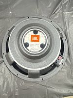 Top view of JBL ME150H woofer showing basket and center label