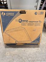 Front of sealed carton showing Lithonia Lighting branding and product illustration