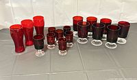 All 16 red glass pieces arranged on table