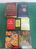 Group shot of all seven books laid out