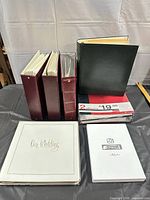 Front view of all six albums standing and lying on table