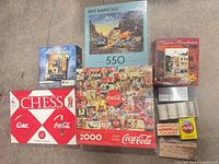 Overall view of boxed puzzles and Coca-Cola chess set