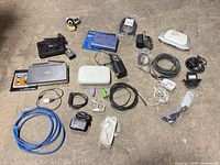 Group shot of all routers, switch, access point, camera, power adapters and cables