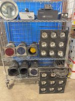 Full shelving view showing fog machines, PAR cans, blinder panels, inground light