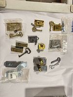 Group shot of all locks, keys, strike plates and packaged pieces