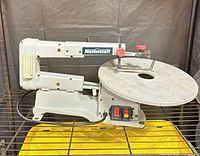 Left side view of Mastercraft scroll saw showing full body and table