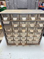 Front view of metal cabinet with all 30 drawers inserted