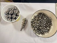 Overview of both containers with mixed diameter ball bearings and graduated chain