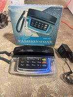 Phone base with handset and box