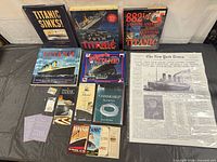 Overview of books, newspaper facsimile, boarding passes, pins and postcards