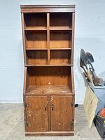 front view closed lower doors showing cubbies and cabinet