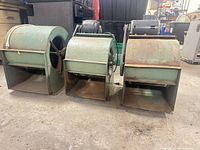 Front view of three centrifugal blowers showing housings and discharge openings