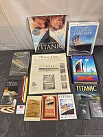 Full lot overview showing book, software box, newspaper, ephemera, pencils and pins