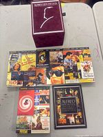 Overall view of outer slipcase and array of DVD cases with booklet