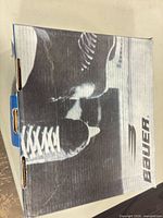 Closed Bauer box with black-and-white skate image and Bauer logo