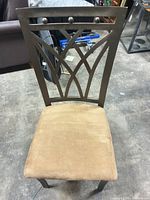 Front view of metal dining chair showing lattice back and microfiber seat
