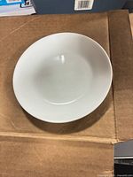 Top view of single white Corelle deep plate