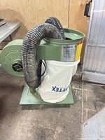 Full view of dust collector with hoses and bag