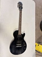 Front view of Epiphone Special II guitar showing body, pickups, controls