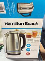 Front of retail box showing kettle image and specs