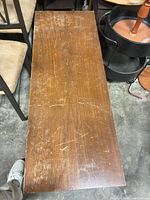 Top view showing scratched walnut-tone veneer surface